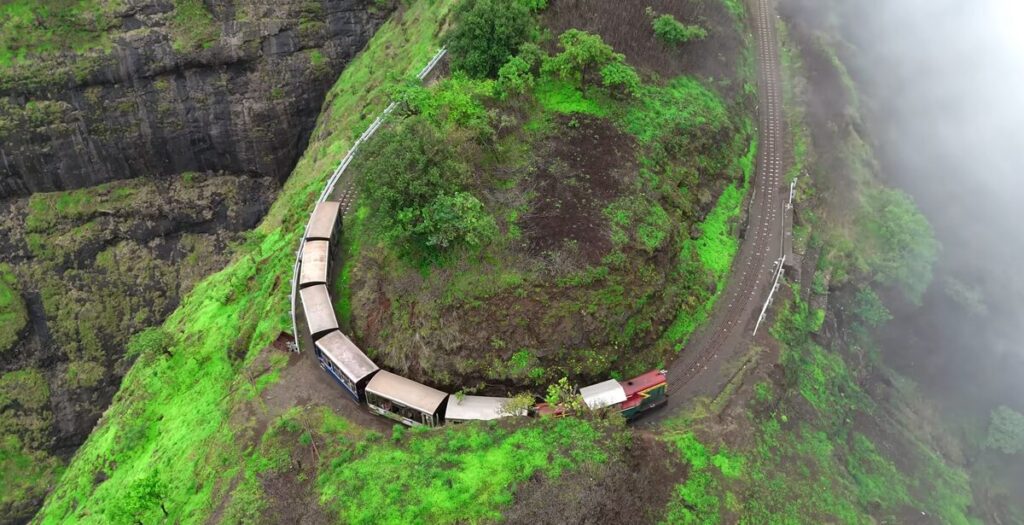 Matheran toy train crossing the zigzag hill track near Nera