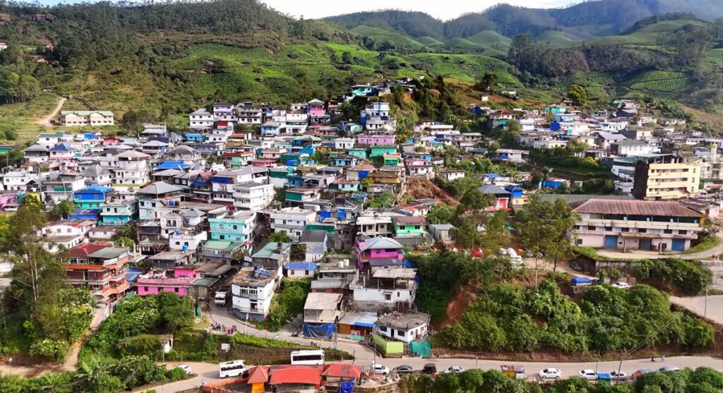 Quiet colony village in Munnar nestled between green hills and fog - Munnar travel guide