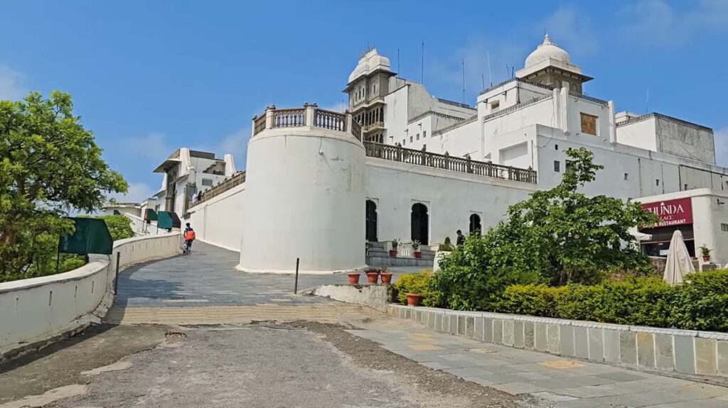 Entrance view of Sajjangarh Fort with gardens in Udaipur