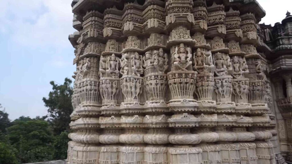 Detailed stone carvings on the walls of Sun Temple near Ranakpur