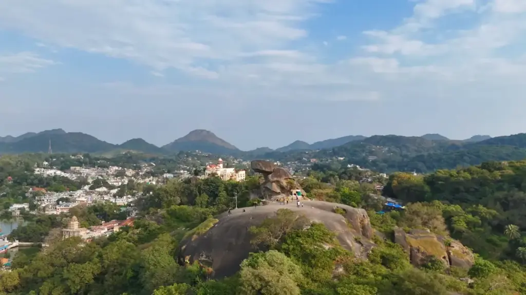 Aerial view of Toad Rock hilltop surrounded by greenery in Mount Abu